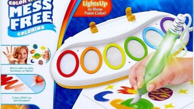 Crayola Magic Light Brush for mess-free painting, showing a child using the light-up brush on Color Wonder paper.