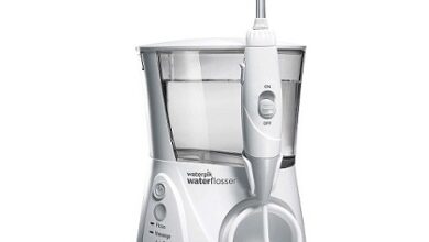 Waterpik Aquarius WP-660 Water Flosser with 10 Settings and 7 Tips on Bathroom Counter