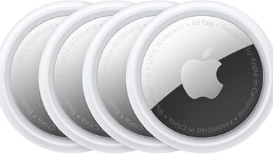 Four Apple AirTags arranged in a square.