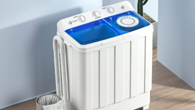 Compact twin tub washing machine, stainless steel and polypropylene construction, ideal for dorms, apartments, and RVs.